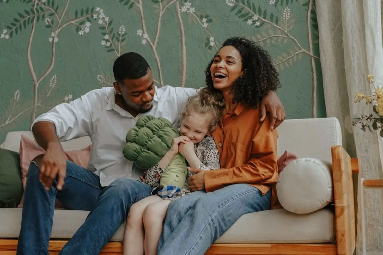 A multigenerational family laughing together at home